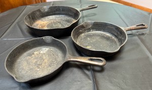 Griswold Cast Iron Pan lot of 3  Noticeable wear but I know you cast iron junkies can makes these puppies brand new