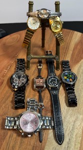 Ladies watch lot of 8  black, gold tone, & various brands untested