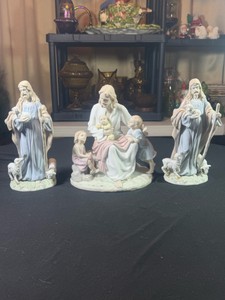 Set of 3 porcelain figurines by The Valencia collection Roman a 2001 Jesus with children & (x2) 1998 Jesus the Good shepherd One of the sheeps on the good shepherd has been repaired broke off glued back on