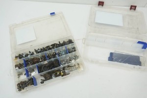 2 organizers one filled with fasteners and hardware