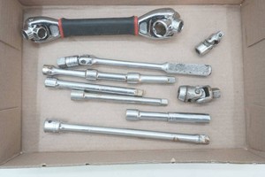 38 drive breaker bar, 38 and 12 extensions, swivel, and a multi size swivel wrench