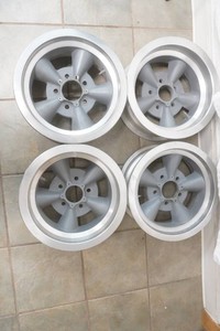 set of 4 vintage 5 spoke style aluminum wheels American Racing Torq Thrust or similar 14 x 7 with a 5 bolt 4 12 OC bolt pattern