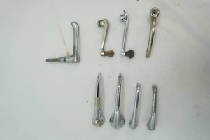 variety of vintage door handles and window cranks