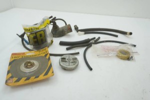 thermostat housing vintage Pontiac, vacuum hoses, thermostat, radiator cap, fuel tank to filler neck hose