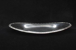 vintage oval serving dish with ornate floral rim resembles mid century Hollowware