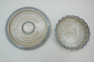 stoneware dinner plate and pie plate in speckled  beige glaze accented with soft blue-grey band on the rim and center