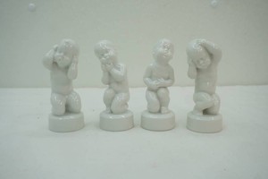 group of 4 Bing & Grondahl white porcelain figurines #2206, #2207, #2208, #2209 representing the Four Aches series Stomach ache, tooth ache, head ache, ear ache