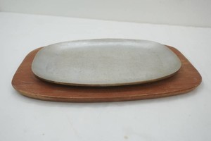 vintage mid-century modern cast aluminum sizzling steak platter with wooden charger 1960s era