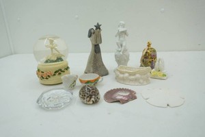 variety of decor including seashells, hand bell, globe, sand dollar and more