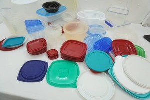 large assortment of food storage containers and lids, just like at home more lids than containers