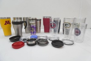 large group of travel mugs in a variety of sizes