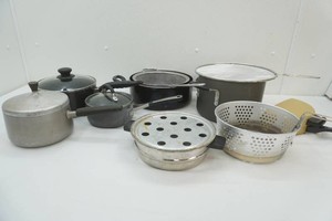 variety of cookware, splatter screens, deep fry basket, pots and pans some with lids