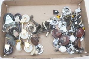 group of casters, vintage drawer pulls and appliance knobs