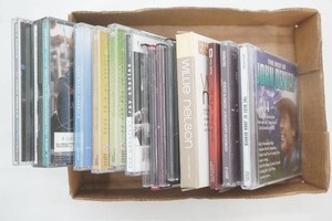 music CDs including Willie Nelson, George Thorogood, Paul Simon, Ray Charles and others