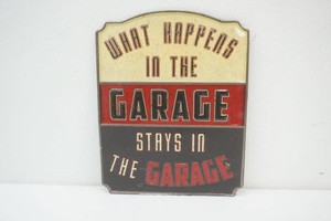 metal sign What Happens in the Garage 10 x 12