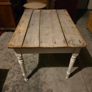 Rustic Farmhouse-Style Table with Distressed Plank Top