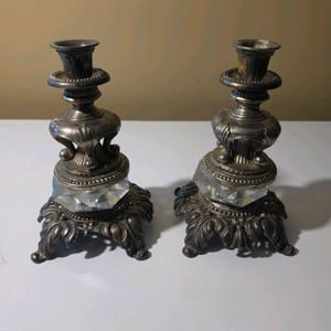 Pair of Ornate Metal Candlestick Holders with Scrollwork Bases