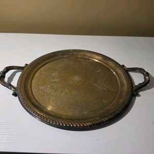 Round Metal Serving Tray with Decorative Handles and Patterned Rim