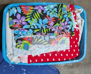 Assorted Quilting and Craft Fabric in Blue Storage Tote