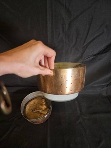 Perforated Copper-Colored Vessel With Base and Separate Component
