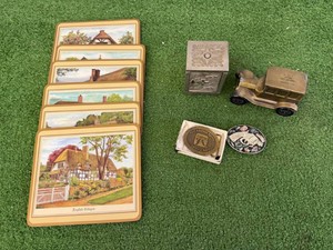 Coin Banks, Belt Buckles & Table Mats