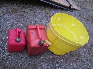 Gas cans and a plastic container
