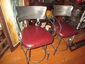 Pair of heavy metal framed swivel chairs