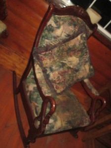 Wood framed upholstered rocking chair