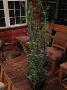 Artificial plant in a planter