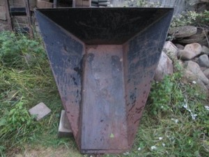 Tree planter attachment for a skid steer