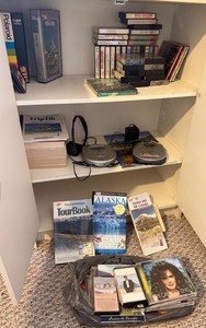 Box Lot of Portable CD Players, CDs, Cassettes & Travel Guides