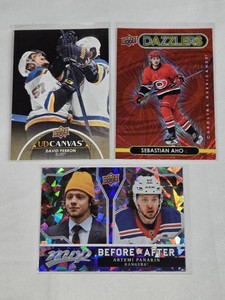 Lot of 3 Hockey Cards Featuring Sebastian Aho, Artemi Panarin, and David Perron with Special Features from Upper Deck and MVP Series