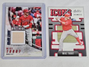 Lot of 2 Mike Trout Baseball Cards featuring 2025 Topps Major League Material and 2021 Panini Absolute Icons.