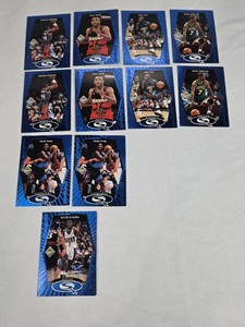 Lot of 11 Basketball Cards Featuring Hakeem Olajuwon, Shawn Kemp, and Other NBA Players. Includes 1998 Upper Deck Starquest Set.