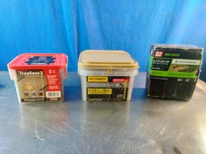 Three containers of fasteners