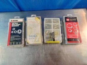 Four different clear plastic hardware assortment boxes