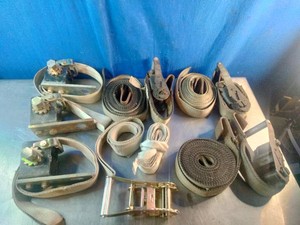 Assortment of used heavy-duty ratchet tie-down straps