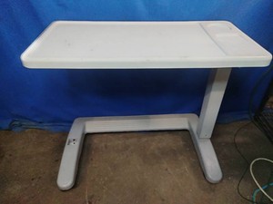 Adjustable plastic overbed table,