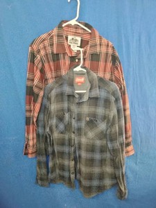 Two mens long-sleeve plaid flannel button-up shirts