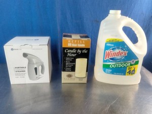 lLarge 128 fl. oz. jug of Windex Outdoor Glass Cleaner Refill on the right, alongside a portable garment steamer box on the left and an 80-hour candle refill box in the middle