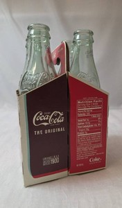 Vintage 4 Pack Retro Coca Cola Bottles With Carrier - Bottles are empty- These are limited edition bottles- Very Collectible