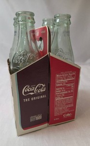 Vintage 4 Pack Retro Coca Cola Bottles With Carrier - Bottles are empty- These are a limited edition bottles