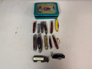 Fourteen Collectible Pocket Knives in Anheuser-Busch Collector Tin