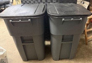 Two Rubbermaid Commercial 50 Gallon Rolling Garbage Cans
