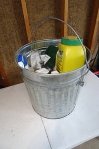 Metal Bucket with Assorted Lawn Care