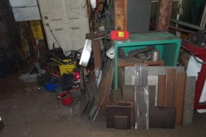 Contents of Corner - Steel Plate, Chain Saw Tools, Angle Blocks
