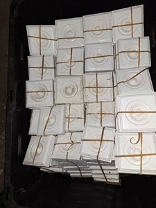 Bin of 200 white trim rosettes