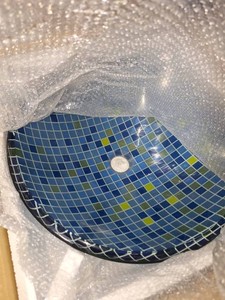 Blue checkered glass vessel sink
