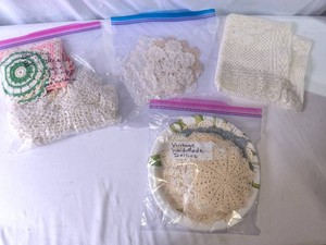 Different sized and shaped Doilies with Barbie Doll Doilie Dress