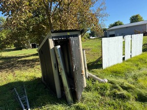 Steel framed shed was used for outdoor wood furnace could be a good start to a smoker. Include flues